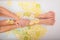 Faceless beautiful young woman takes a bath with milk lemons and lime. Cropped photo. Close-up of female hands and feet