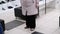 Faceless Elderly woman trying on new shoes in a shoe store