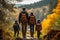 Faceless family walking hike through colorful autumn forest. Rear view of parents and children walking on trail