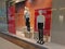 Faceless mannequins in white T-shirts and black jeans stand next to the inscription `The Sale` and `Discounts up to 50 %`