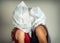 Faceless portrait of two young kissing girls with plastic bags on their heads