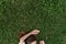 Faceless shot of woman lying on green grass