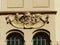 Faces engraved as decoration in  an ancient building of Prague in Czech Republic