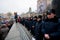 Faces of the police forces guarding the last monument of the communist leader Lenin during the pro-European protest