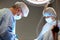 faces of surgeons in the operating room during the operation. Modern medicine, medical workers during a complex