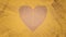 Faceted heart against textured yellow background