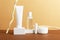 Facial and body care cosmetics bottles composition on brown background. Gel tube, lipstick, cream jar unbranded blank packages