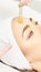 Facial brush peel retinol treatment. Beauty woman peeling procedure. Cosmetology young girl therapy.Hyaluronic acid