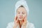 Facial care and beauty treatments. Beautiful woman with a sheet moisturizing mask on her face