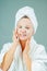 Facial care and beauty treatments. Beautiful woman with a sheet moisturizing mask on her face