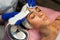 Facial cleansing procedure with ultrasonic scrubber.