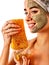 Facial honey clay face mask woman . Honeycombs homemade organic threatment.