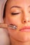 Facial madero massage with a face roller