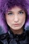 Facial portrait of beauty in purple wig