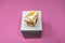 Facial Tissue Cube Box. Peach colored tissue paper