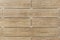 Facing the building with a ventilated facade. Wood texture, brown wood pattern. Close-up background