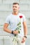 In fact he is dating. Handsome man dating. Caucasian guy holding red rose gift for dating anniversary. Dating or meeting
