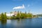 Factory along a river on a clear autumn day