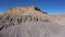 Factory Butte Of Steel Grey Mudstone Rocks Formation In Utah Desert Valley