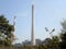 Factory chimney, industrial smoke chimneys, Tall industrial factory chimney smokestacks of jute mill industry in Ganges riverside