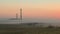 Factory at dawn in the mist timelaps
