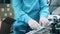 Factory employee is packing pill jars into a box