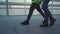 Factory engineers legs walking in modern greenhouse wearing green uniform