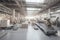 a factory floor, with robotic arms and vehicles moving goods between workstations