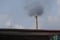 Factory flue emit smoke, pollution, industry that negatively affects the environment