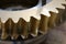 Factory Industrial of brass gear machinery. Metal Gear wheels. Machine part. Closeup