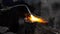 Factory and Industrial concept, Metallurgy. Welding equipment. Yellow flame melting metal in Slow motion. Merge