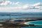 Factory on the island close to the beach and ocean. Above view. Bluff, New Zealand I