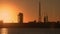 Factory and oil refinery during sunset lens flare
