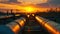 Factory pipeline at sunset, crude gas and oil pipes of refinery plant or petrochemical industry. Scenery of steel industrial tube