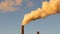 Factory plant smoke stack over blue sky background