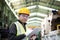 Factory worker with clipboard on the hand