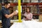 Factory Worker And Manager Checking Goods On Production Line