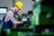 Factory worker measure detail with digital caliper micrometer during finishing metal working on lathe machine