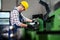 Factory worker measure detail with digital caliper micrometer during finishing metal working on lathe machine