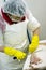 Factory worker slicing fish