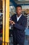 Factory Worker Using Powered Fork Lift To Load Goods