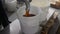 Factory workers filling out pails with honey