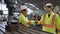 Factory workers handshake with team member in the factory