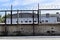 Factory zone barbed wire fence and buildings