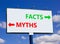 Facts or myths symbol. Concept word Myths and Facts on beautiful billboard with two arrows. Beautiful blue sky with clouds