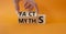 Facts vs Myths symbol. Businessman Hand turns cubes and changes word Myths to Facts. Beautiful orange background. Business and