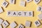 FACTS word written on wood block. Wooden abc