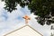 Faded cross on church roof