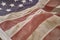 Faded Old Vintage American Flag spread out and wrinkled