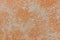 Faded orange plaster wall texture. Textured background